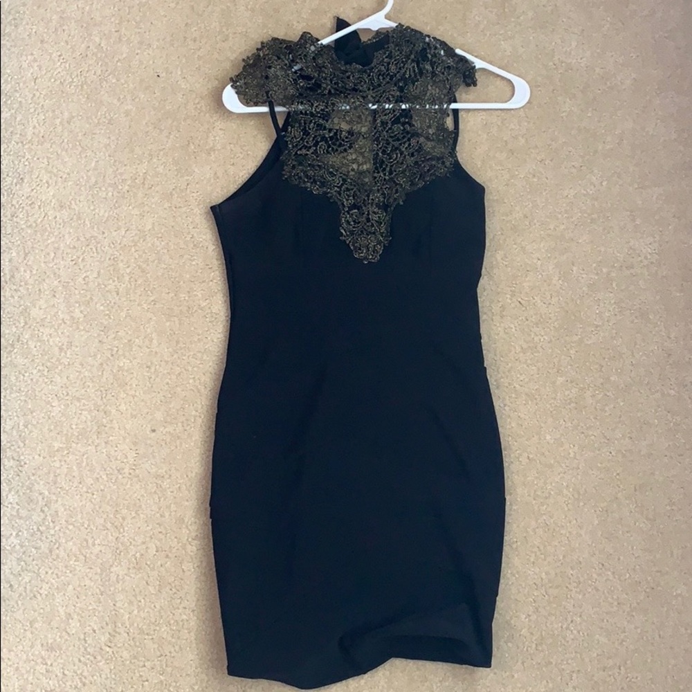 Black dress with gold colored pattern top